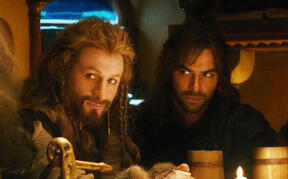 Fili and Kili from The Hobbit sitting next to each other during the dinner party at Bilbo’s house