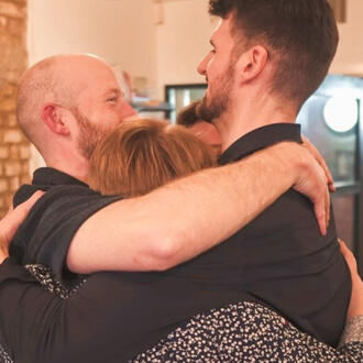 The four members of Shoot from the Hip hugging